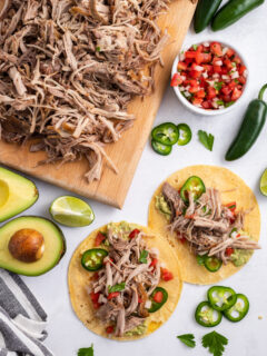 carnitas on a board and then added to tortillas