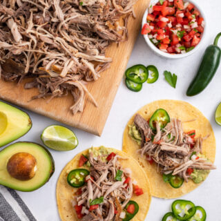 carnitas on a board and then added to tortillas