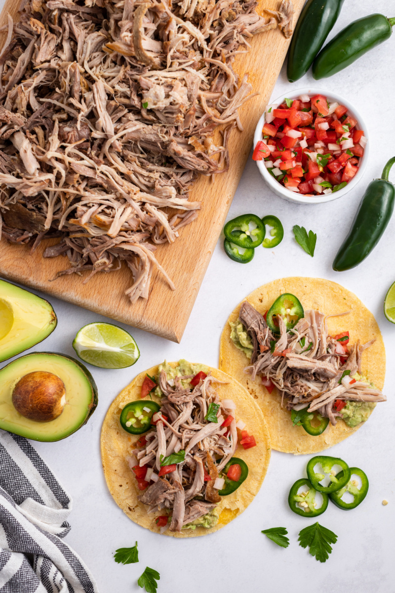 carnitas on a board and then added to tortillas
