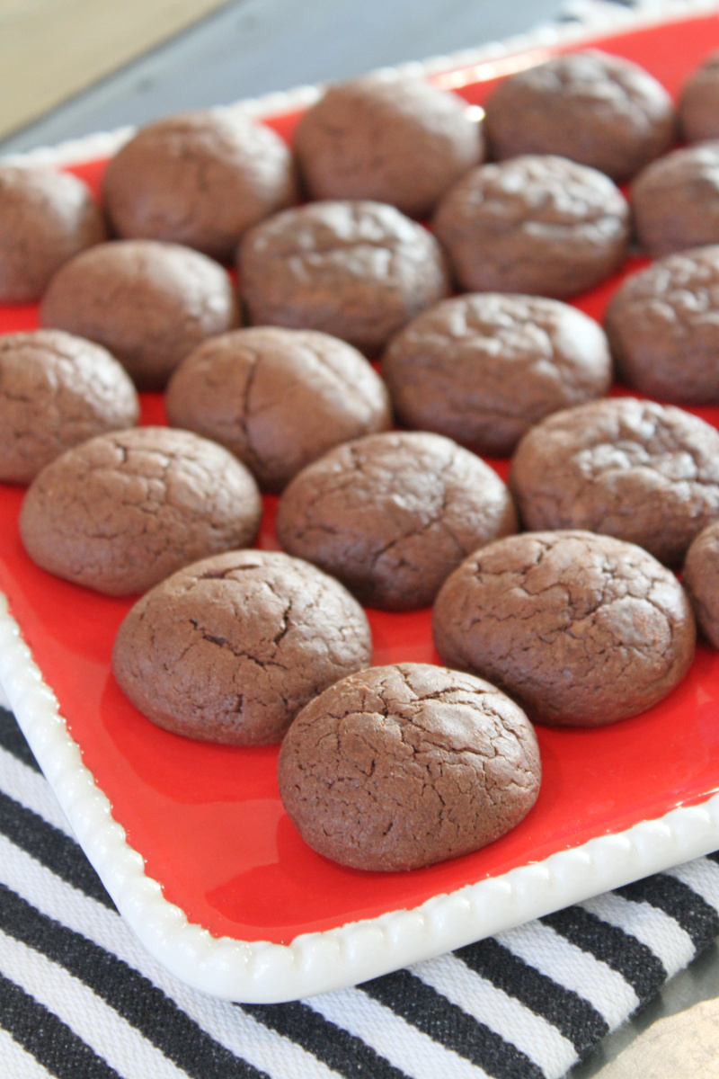 brownie fudge bomb cookies on a red platter