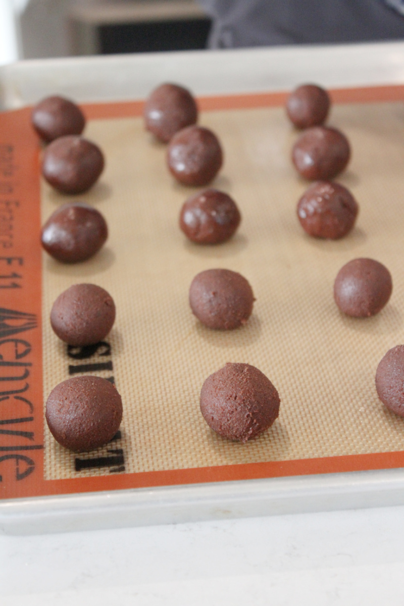 brownie cookie dough balls on baking sheet