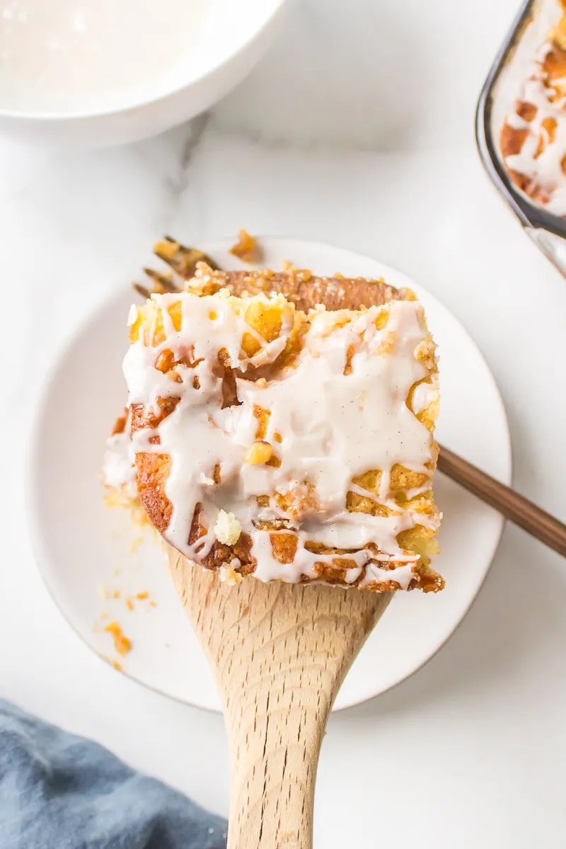 slice of cinnamon roll cake on wooden spoon