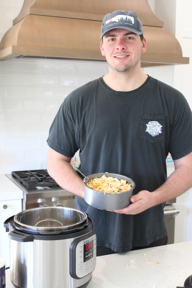 recipeboy holding queso to be put into instant pot