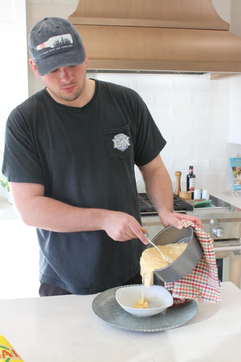 recipeboy pouring queso into bowl