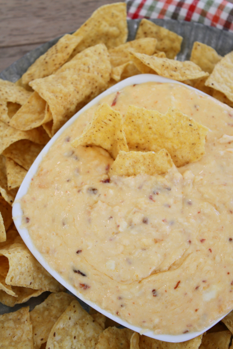 queso in a bowl and then chips
