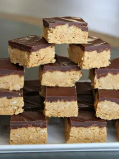 stack of no bake peanut butter bars on platter