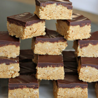 stack of no bake peanut butter bars on platter