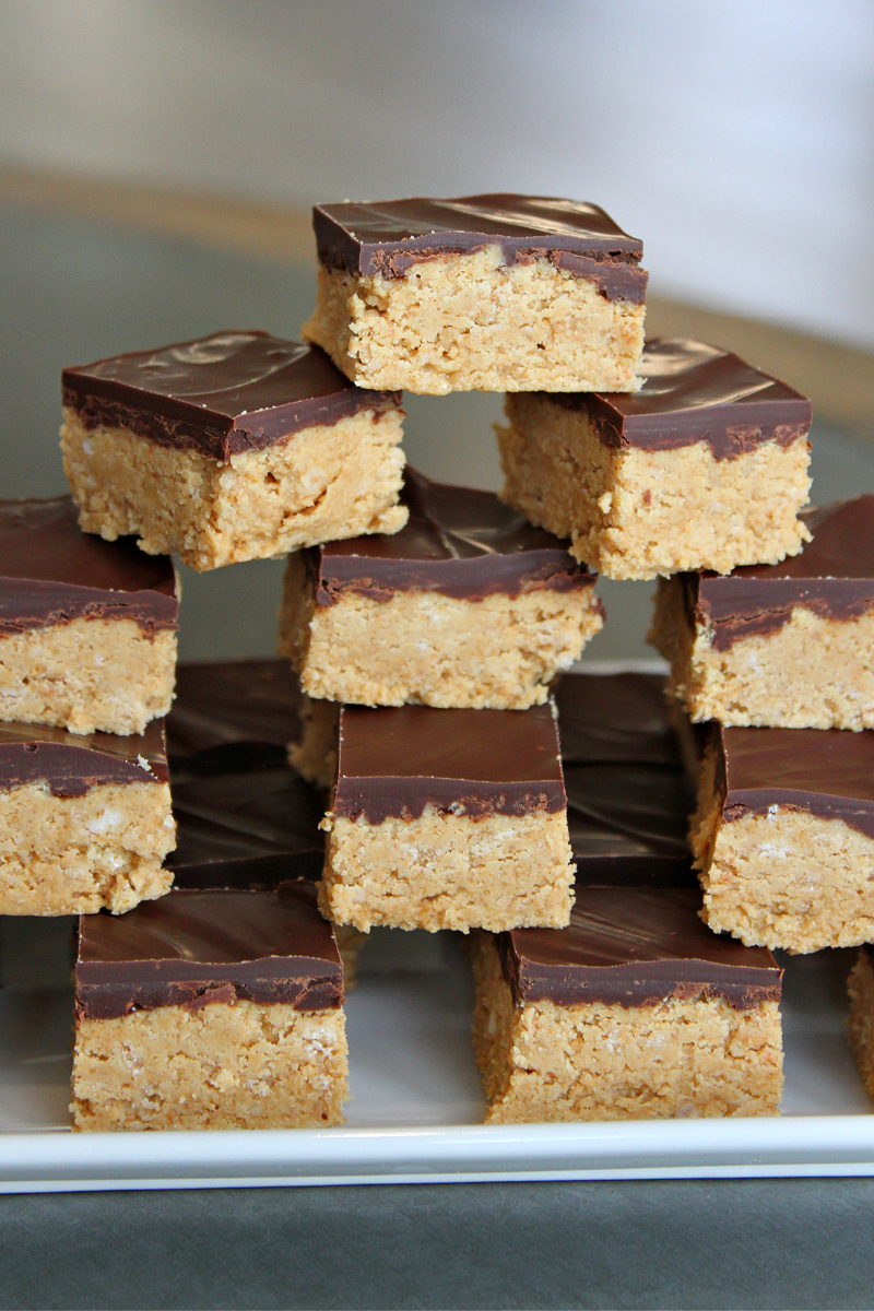 stack of no bake peanut butter bars on platter