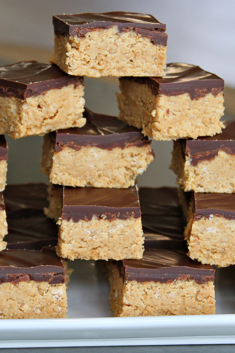 stack of no bake peanut butter bars on platter