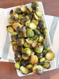 roasted brussels sprouts on a white platter