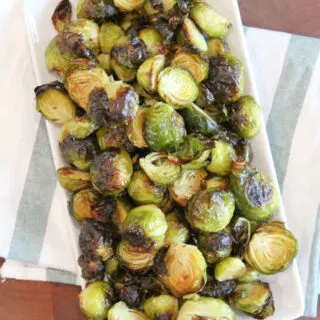 roasted brussels sprouts on a white platter