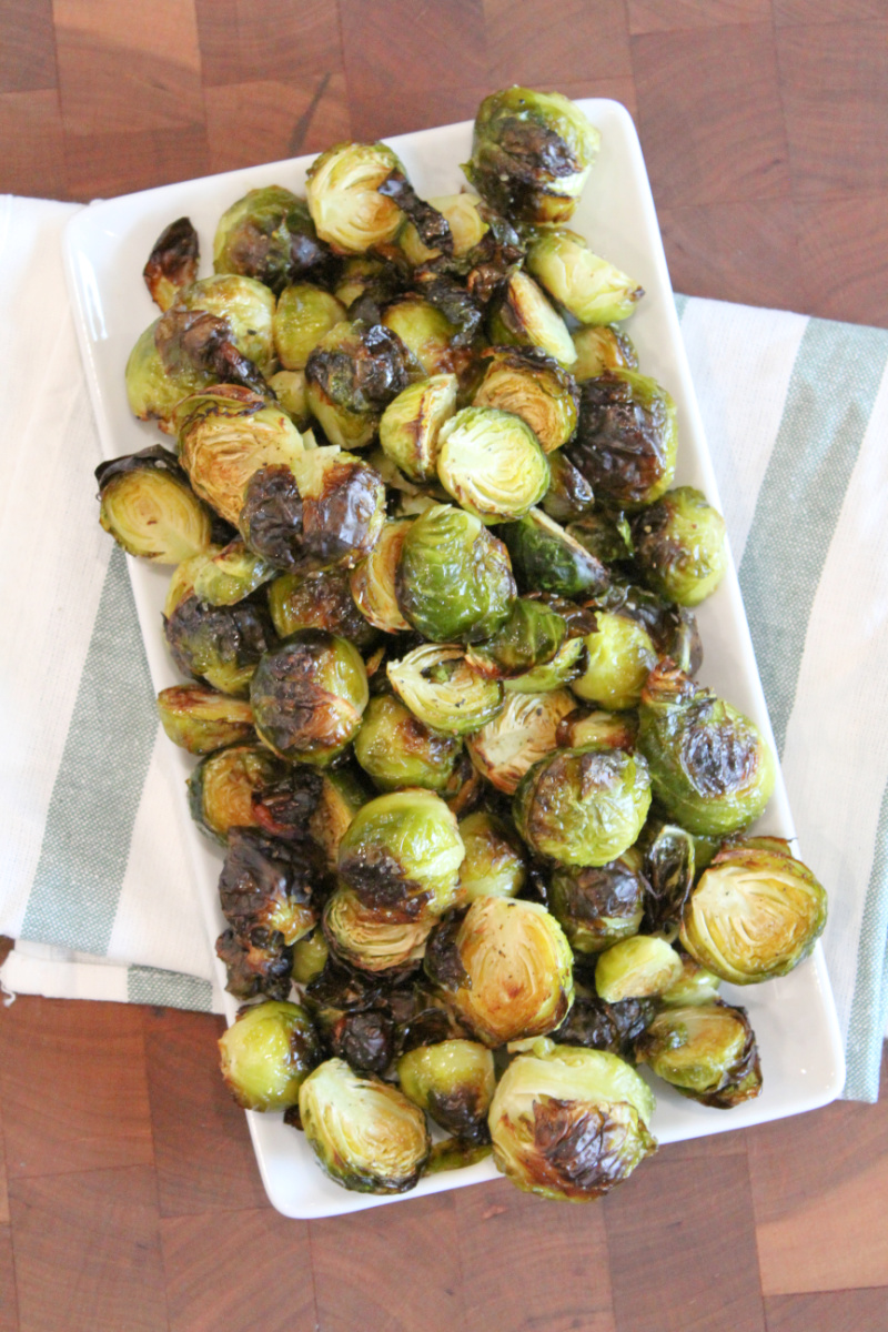 roasted brussels sprouts on a white platter