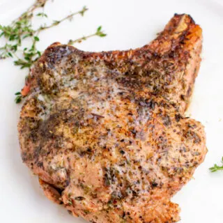 juicy skillet pork chop with fresh thyme