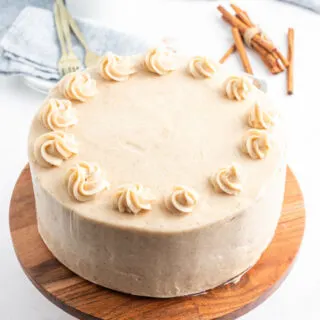 snickerdoodle cheesecake cake on platter