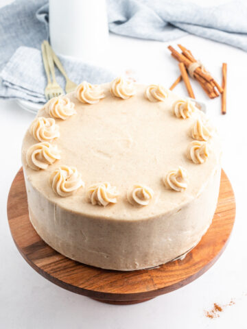 snickerdoodle cheesecake cake on platter