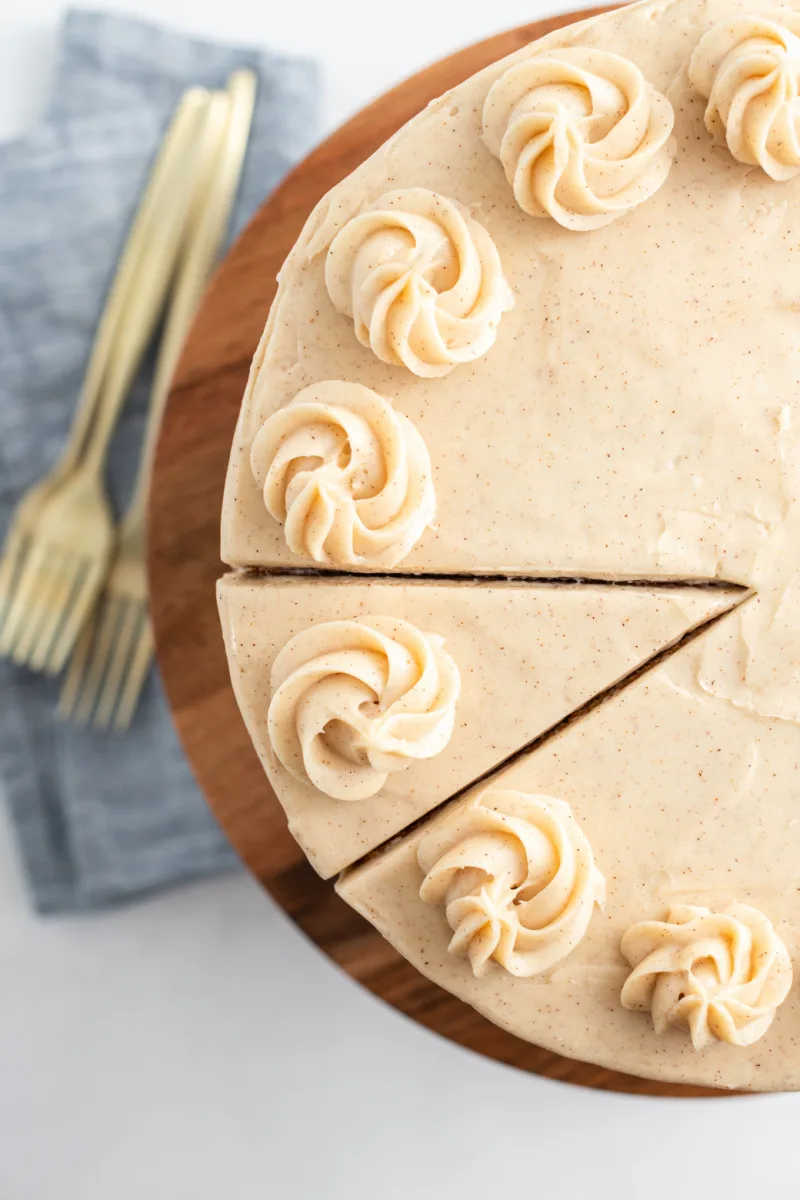 snickerdoodle cheesecake cake with first slice sliced into it