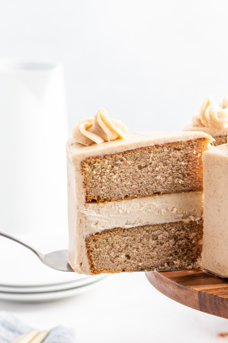 slice being removed from snickerdoodle cheesecake cake