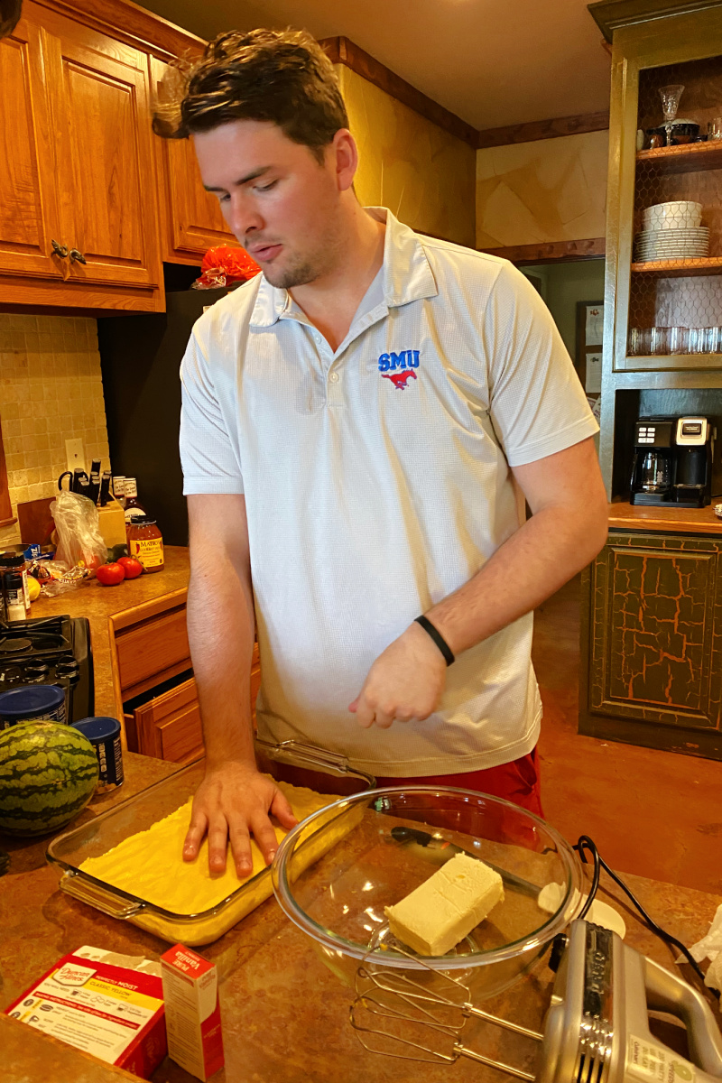 recipeboy patting crust into pan