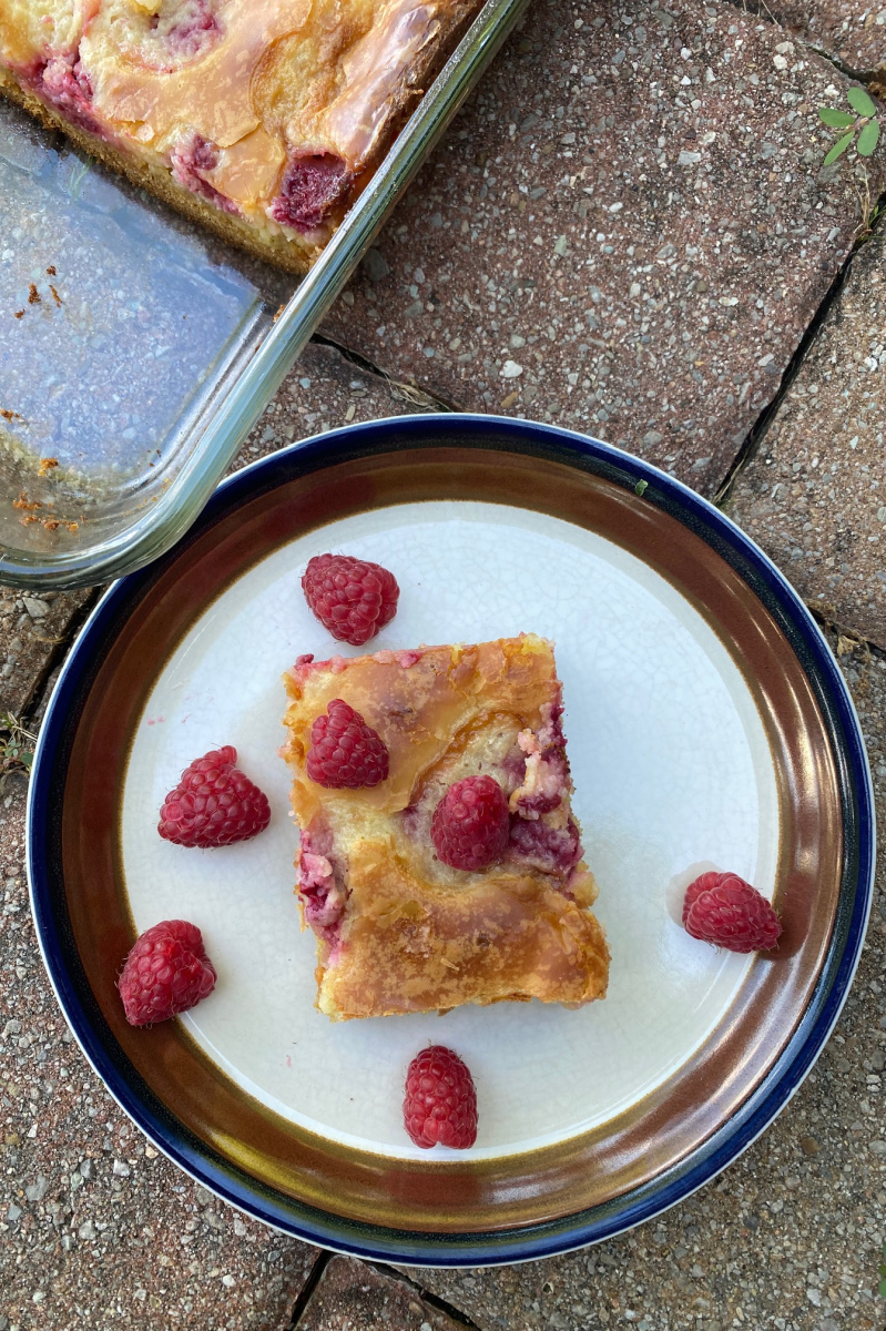 slice of raspberry gooey butter cake on a plate