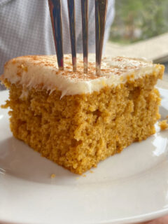 Slice of pumpkin sheet cake with a fork