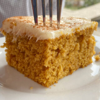 Slice of pumpkin sheet cake with a fork