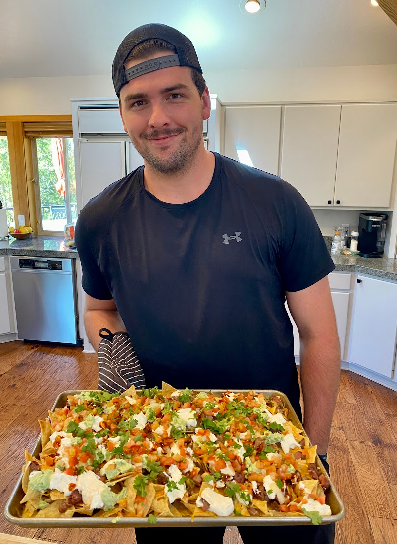 recipeboy holding a pan of nachos