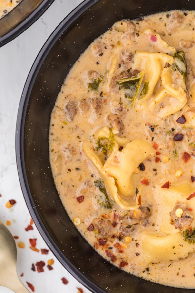 close up of bowl of sausage tortellini soup