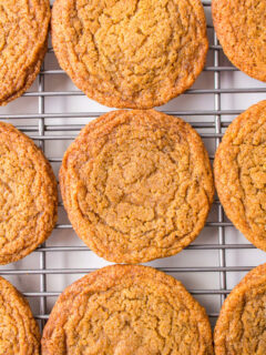 chewy gingerbread cookies on a baking rack