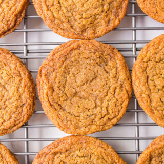 chewy gingerbread cookies on a baking rack