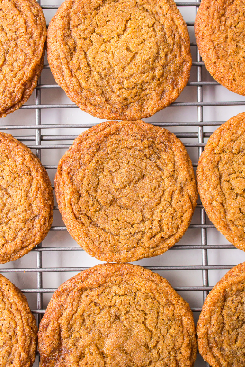 chewy gingerbread cookies on a baking rack