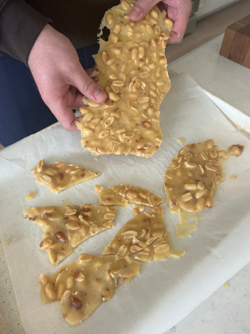 breaking apart peanut brittle