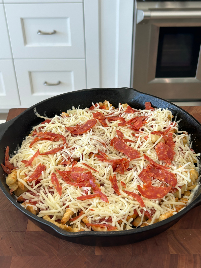 pan of pizza fries ready for oven