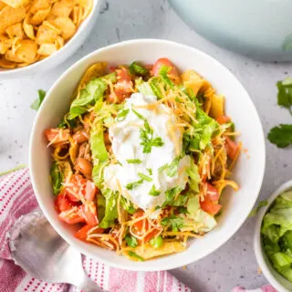 southwest frito pie serving in bowl with toppings