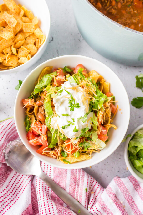 southwest frito pie serving in bowl with toppings