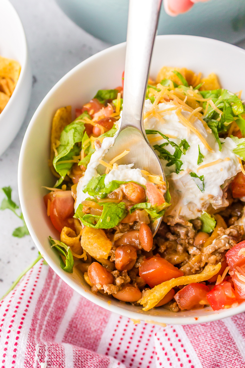 spoon in bowl of frito pie