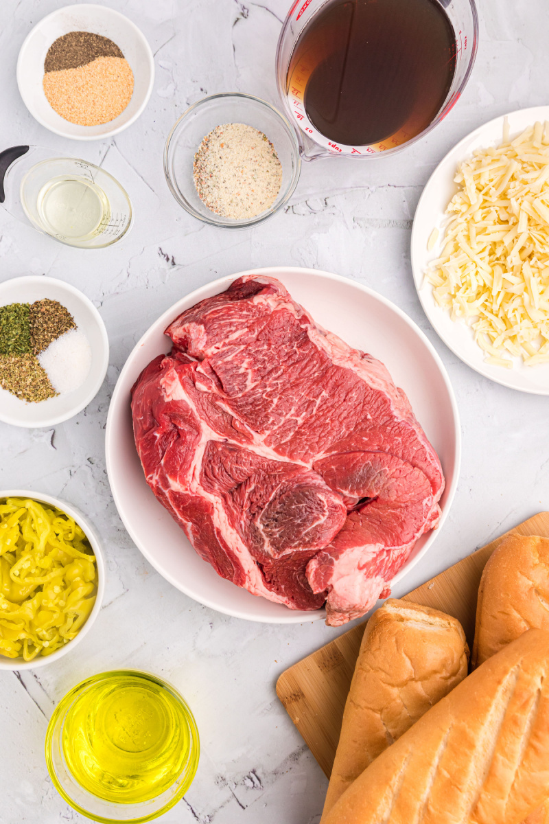 ingredients displayed for making crockpot italian beef sandwiches