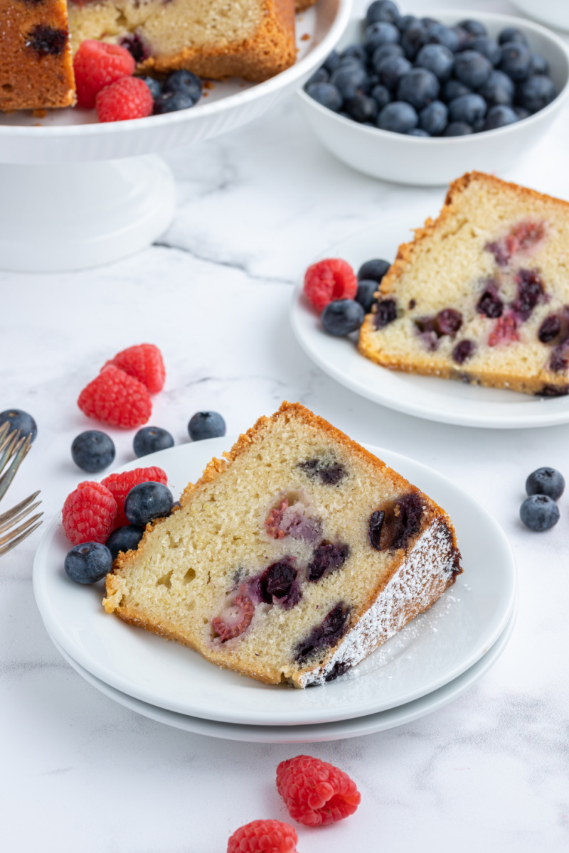 slices of berry pound cake on white plates