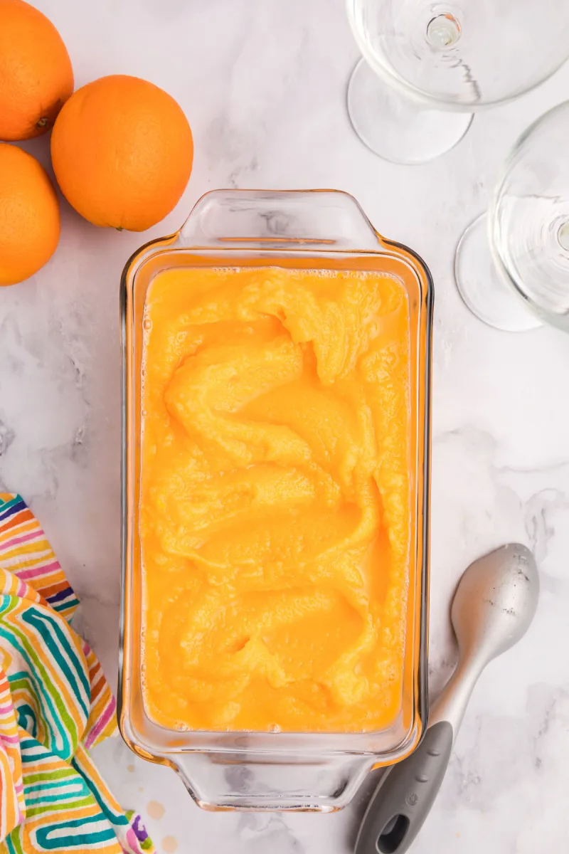 orange sherbet in pan ready for freezer