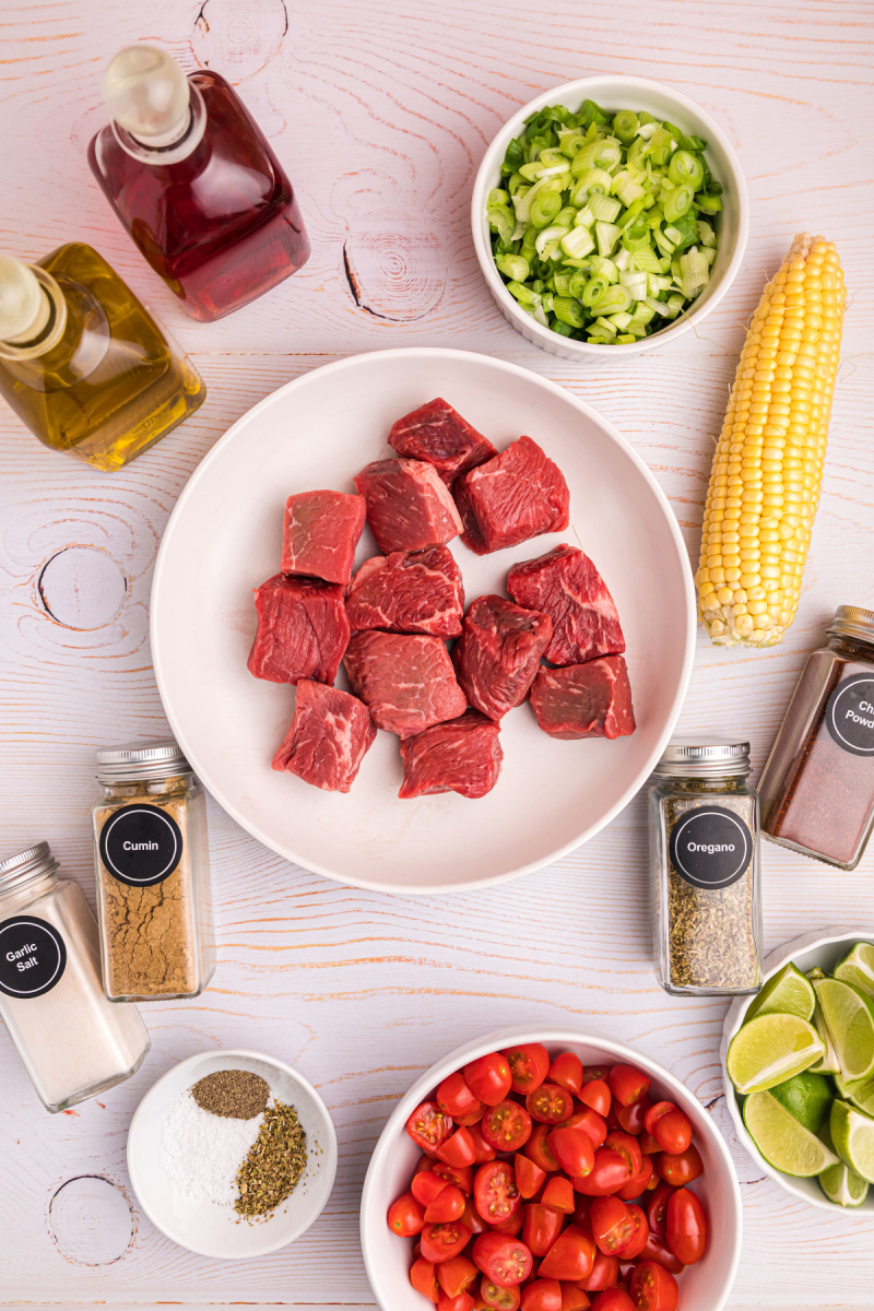 ingredients displayed for making grilled beef kabobs with corn tomato salsa