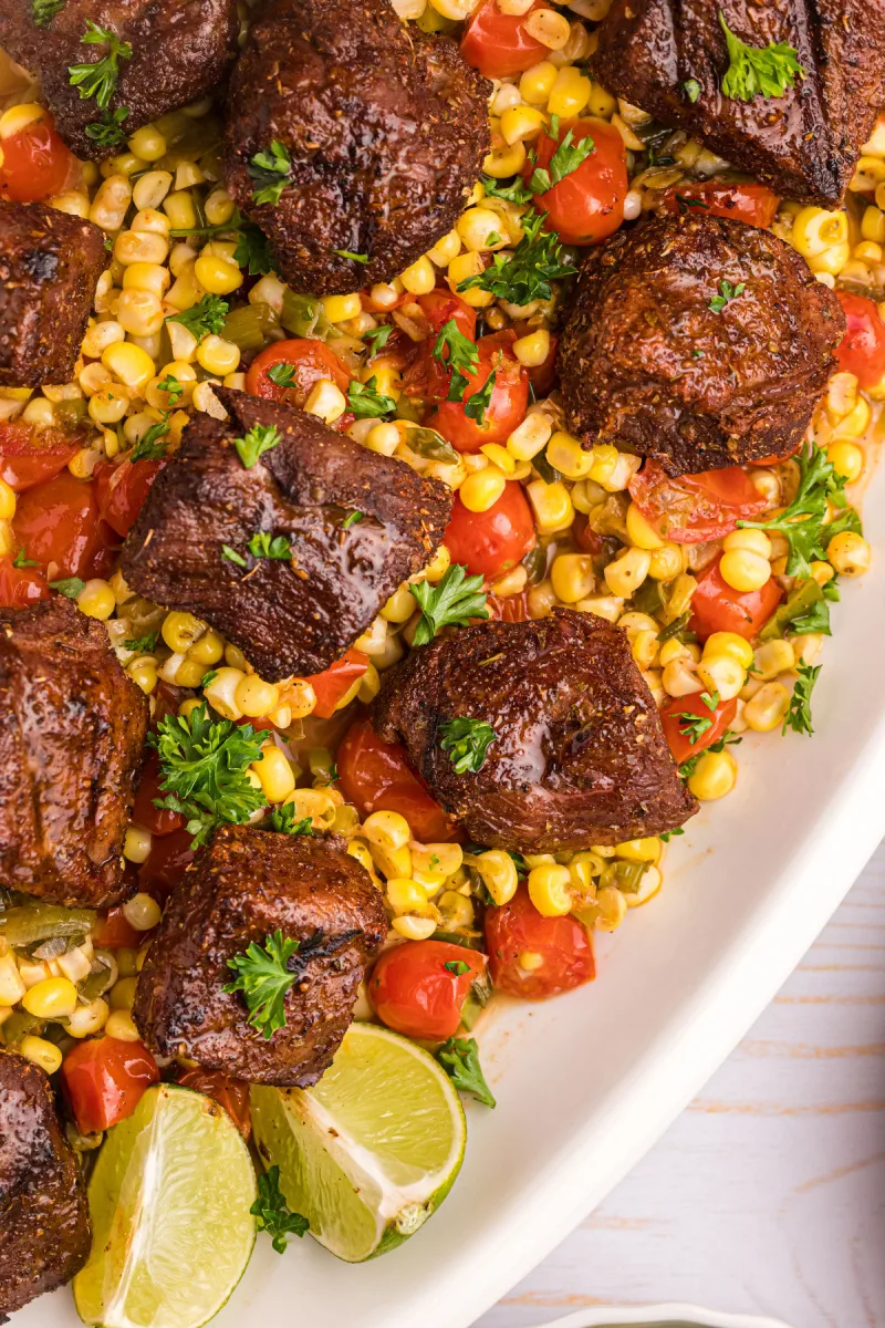 grilled beef over corn tomato salsa