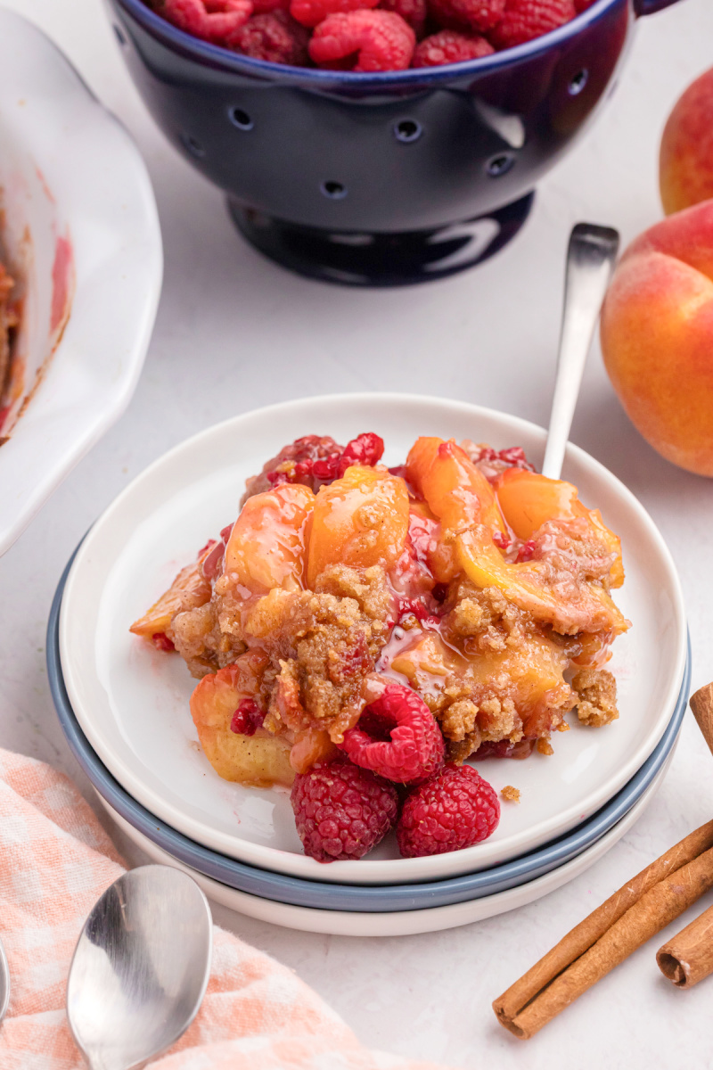 serving of raspberry peach crumble on a plate