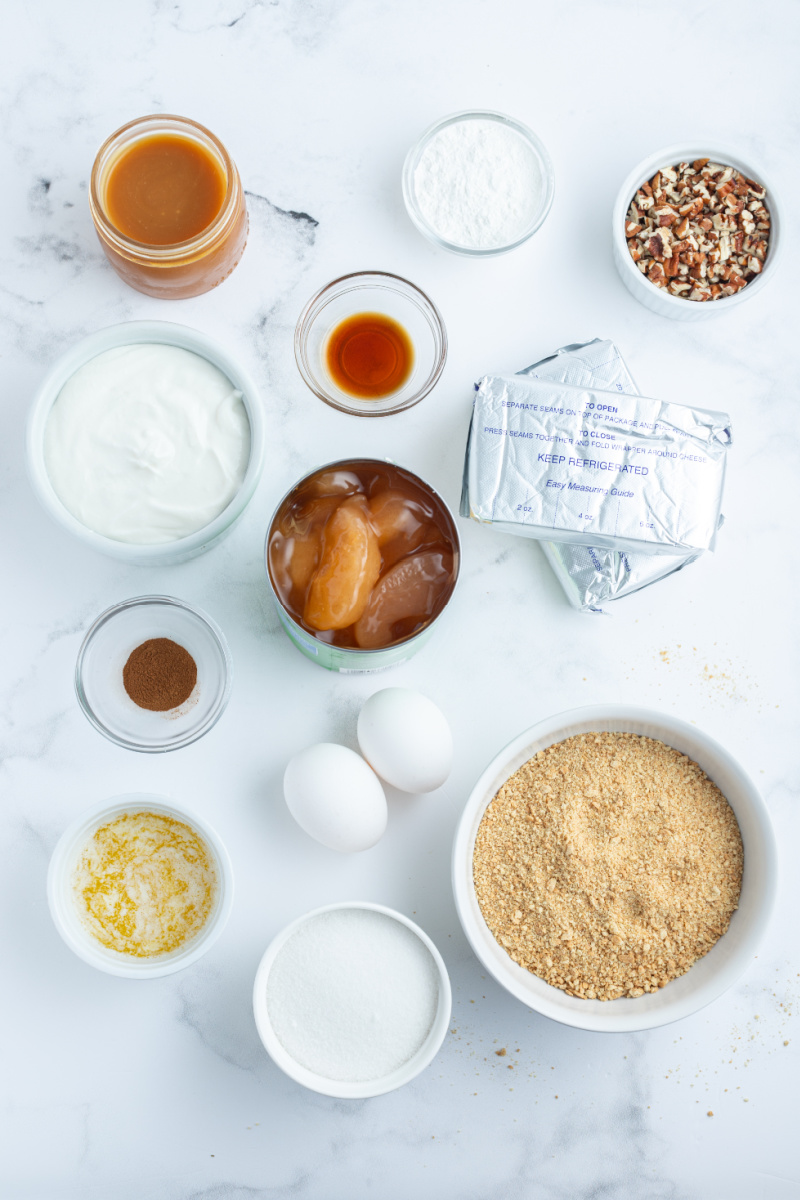 ingredients displayed for making caramel apple cheesecake