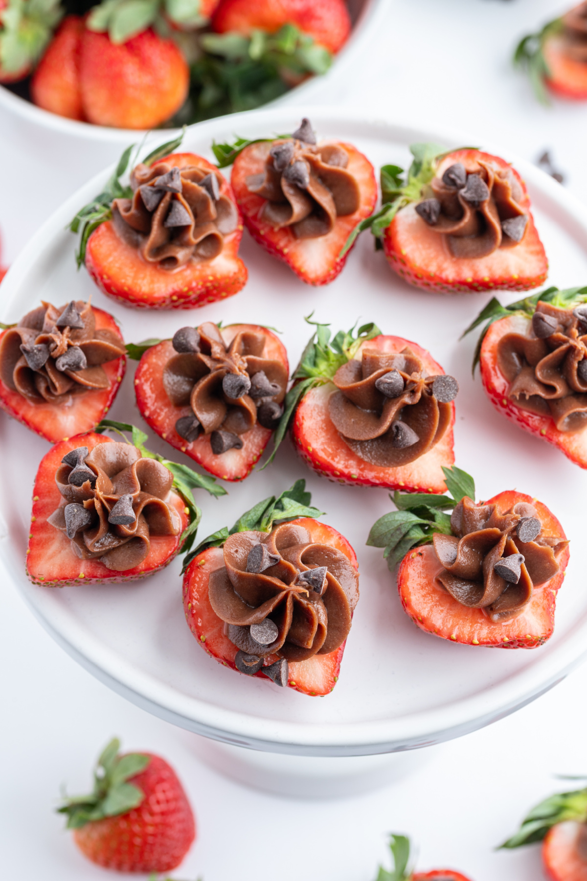 chocolate cheesecake strawberry bites on a platter