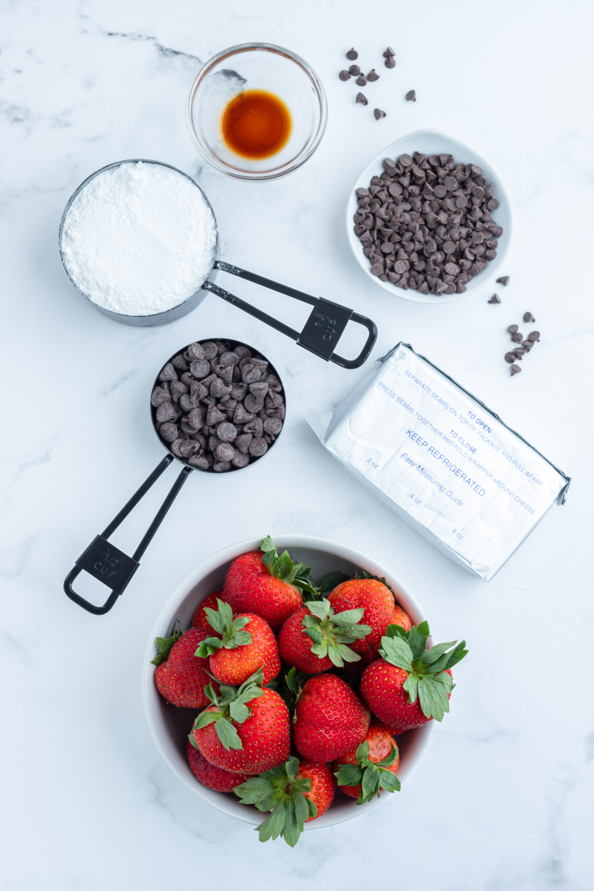ingredients displayed for making chocolate cheesecake strawberry bites