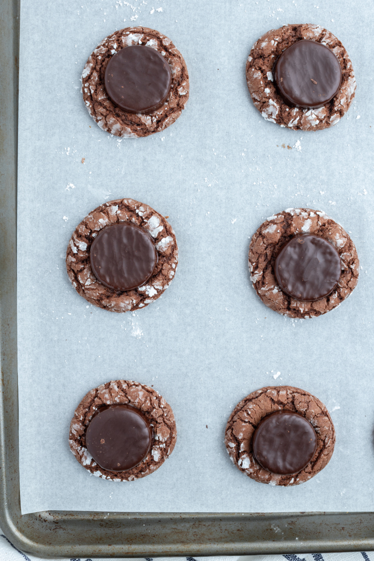 fudgy mint cookies on a baking sheet lined with parchment paper