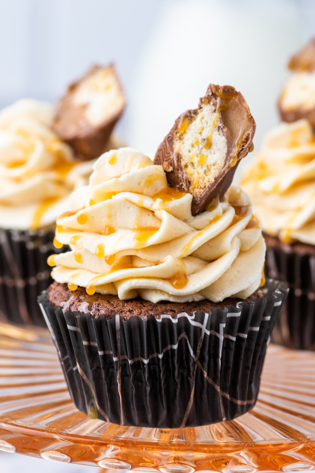 twix bar cupcake with twix bar garnish