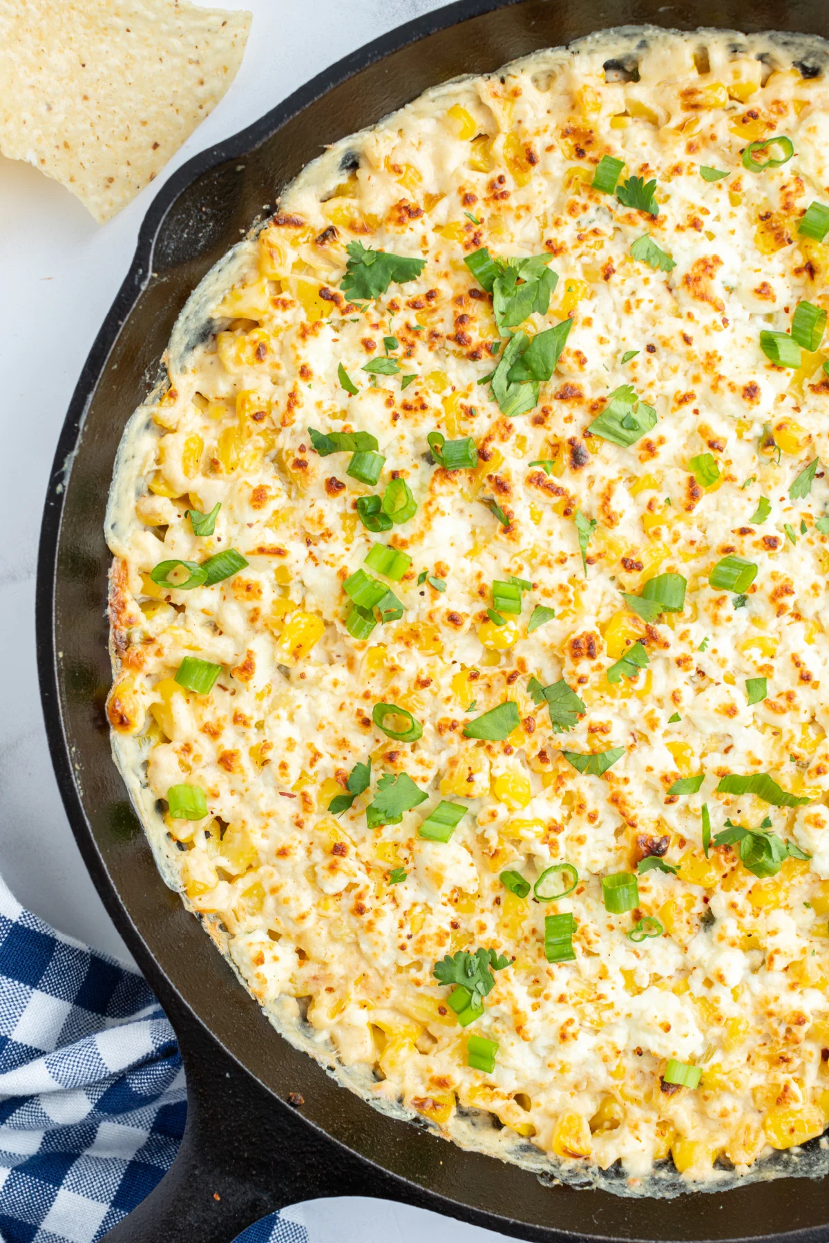 cast iron skillet of baked elote dip