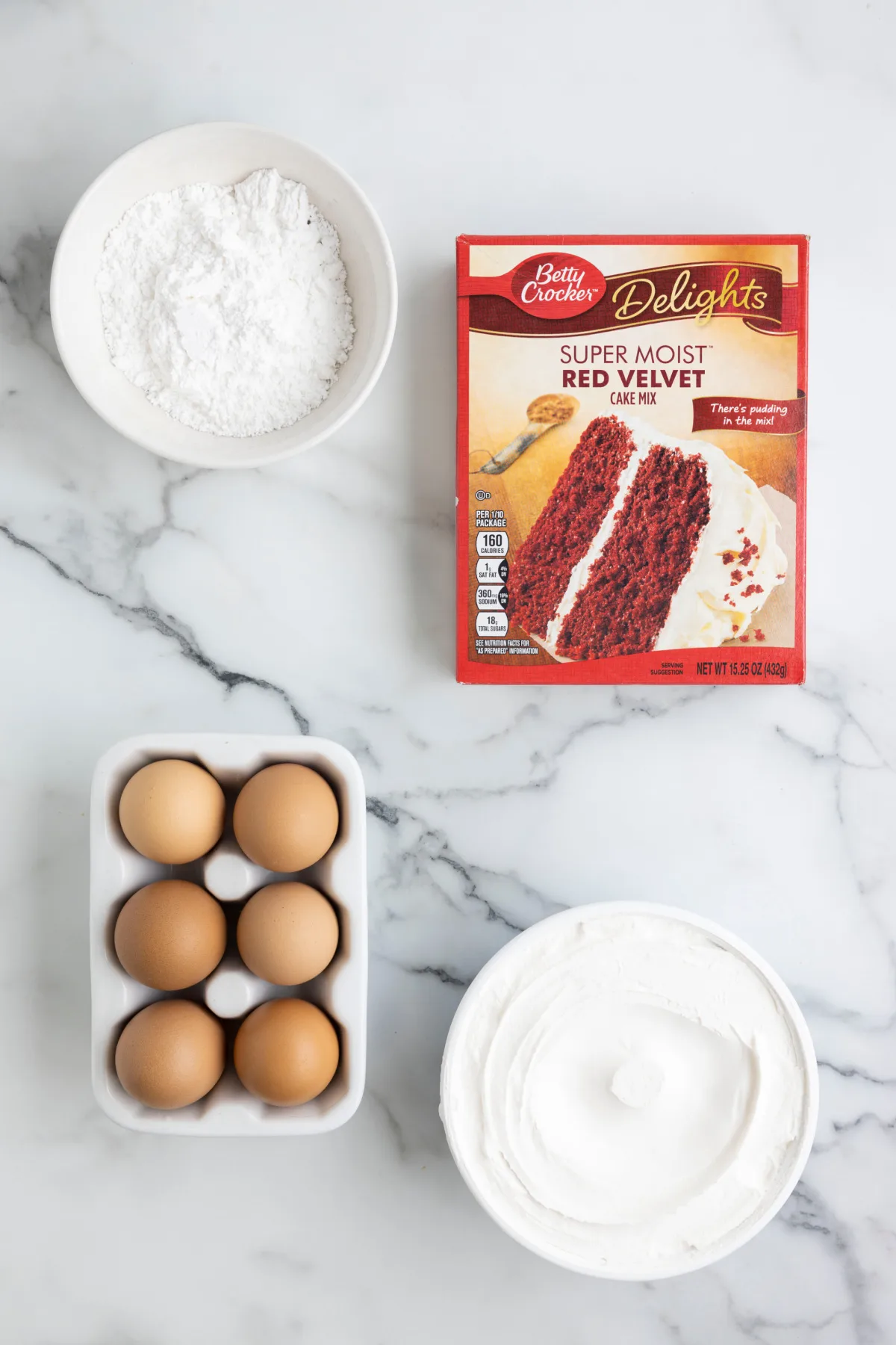 ingredients displayed for making red velvet cool whip cookies