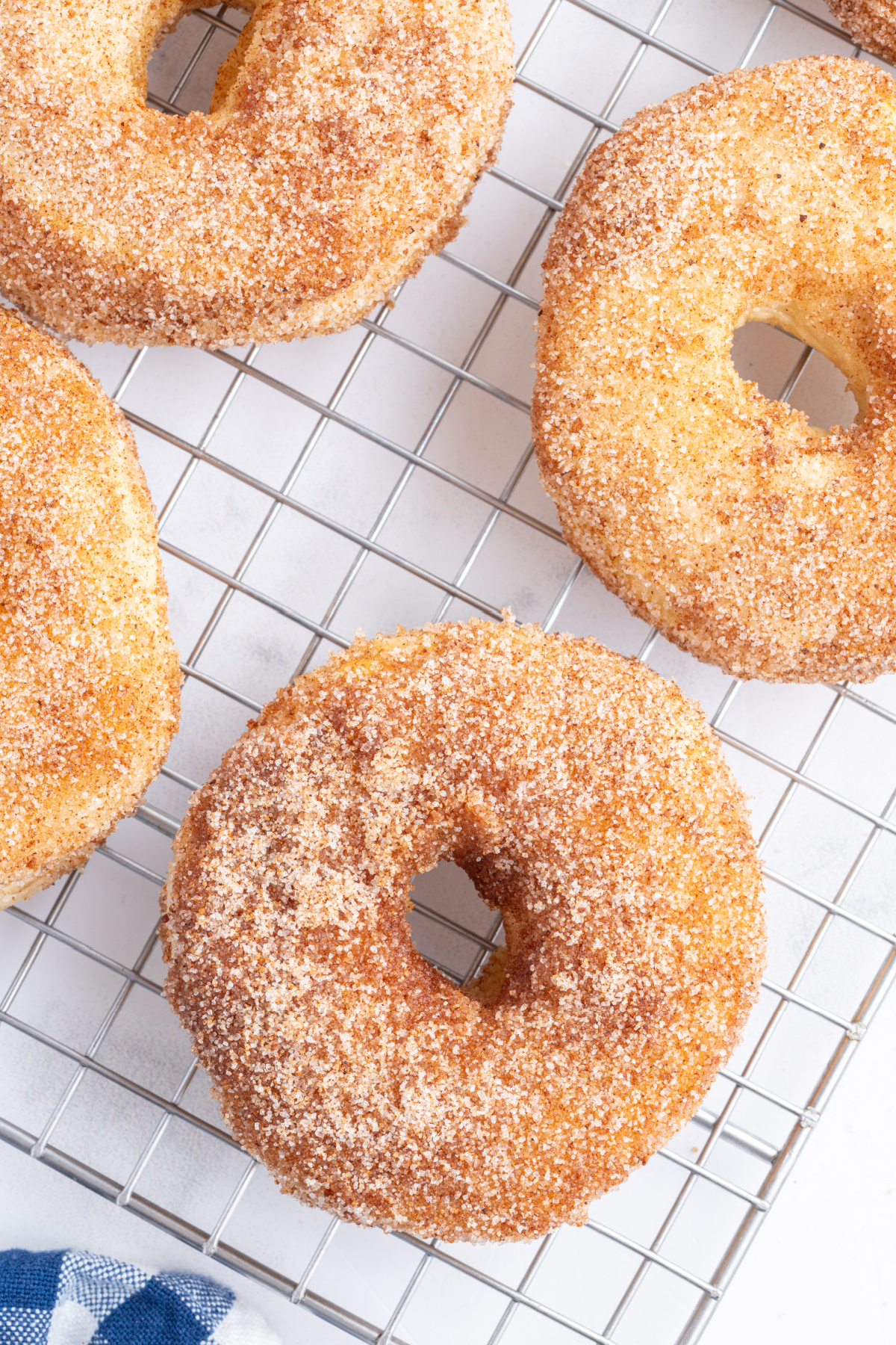 air fryer canned biscuit donuts on a cooling rack