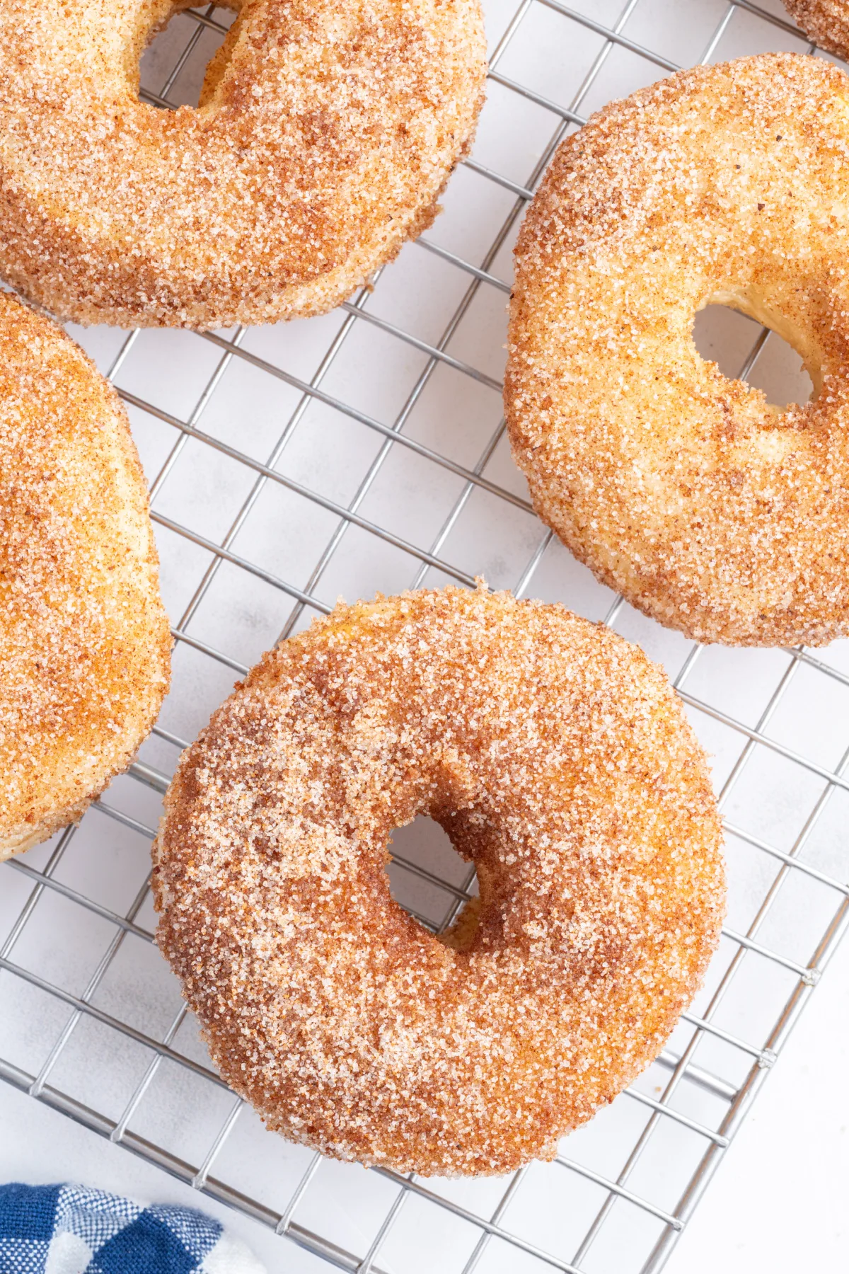 air fryer canned biscuit donuts on a cooling rack